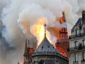 Smoke and flames rise during a fire at the landmark Notre-Dame Cathedral in central Paris on April 15, 2019, potentially involving renovation works being carried out at the site, the fire service said.