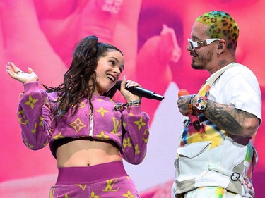 On Coachella Weekend 1, on April 13, 2019, Spanish singer Rosalia and Colombian singer J Balvin perform on stage at the Coachella Valley Music and Arts Festival in Indio, California.