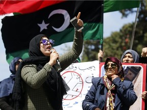 Libyans take part in a demonstration in front of the Ministry of Foreign Affairs, demanding the dismissal of minister Mohammed Sayala and calling on the United Nations to stop interfering in Libya, in the capital Tripoli, on April 28, 2019.