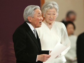 Japan's Emperor Akihito, accompanied by Empress Michiko, speaks during the ceremony of his abdication in front of other members of the royal families and top government officials at the Imperial Palace in Tokyo, Tuesday, April 30, 2019.