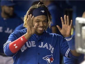 Toronto Blue Jays' Vladimir Guerrero Jr. in his second big league game smiles for the television camera looking into the dugout in the sixth inning of their American League MLB baseball game against the Oakland Athletics in Toronto Saturday April 27, 2019.
