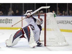 Columbus Blue Jackets goaltender Sergei Bobrovsky tries to keep his balance while defending against the New York Rangers on Friday, April 5, 2019, in New York.