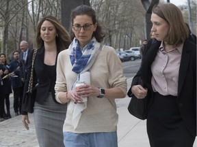 Clare Bronfman, centre, leaves Federal court in the Brooklyn borough of New York, Friday, April 19, 2019. Bronfman has pleaded guilty to charges implicating her in a sex-trafficking conspiracy case against an upstate New York self-help group.