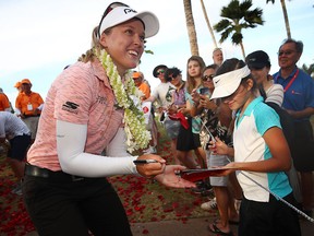 Brooke Henderson signs autographs after winning the LOTTE Championship at Ko Olina Golf Club on Sunday, April 21, 2019, in Kapolei, Hawaii.