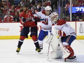 Capitals' Alex Ovechkin (8) and Canadiens' Jordan Weal battle for position in front of goalie Carey Price Thursday night in Washington.