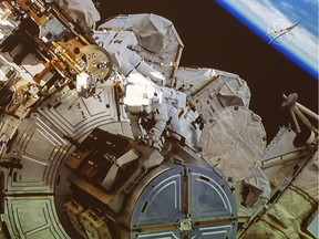 Canadian astronaut David Saint-Jacques takes part in a spacewalk as seen in the livefeed from the Canadian Space Agency headquarters Monday, April 8, 2019 in St. Hubert, Que.THE CANADIAN PRESS/Ryan Remiorz ORG XMIT: RYR101