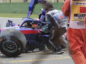 Toro Rosso driver Alexander Albon of Thailand waits for help to get out of his crashed car during the third practice session for the Chinese Formula One Grand Prix at the Shanghai International Circuit in Shanghai on Saturday, April 13, 2019.