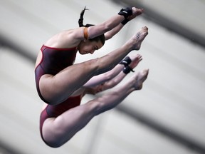 Montreal's Meaghan Benfeito, left, and Clagary's Caeli McKay compete during the women's 10-metre open synchro finals event at the FINA Diving Grand Prix in Calgary, Alta., which they ultimately won.