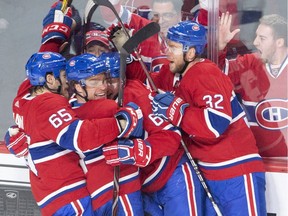 Canadiens centre Max Domi, second left, is congratulated after scoring Montreal's fourth goal Tuesday night at the Bell Centre.