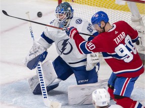 Montreal Canadiens left-winger Tomas Tatar tries to tip in a loose puck in front of Tampa Bay Lightning goaltender Edward Pasquale during second period on Tuesday, April 2, 2019, in Montreal.