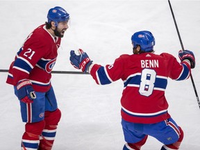 Montreal Canadiens centre Nate Thompson celebrates with teammate Jordie Benn after scoring his team's first goal of the game against the Tampa Bay Lightning during first period on Tuesday, April 2, 2019, in Montreal.