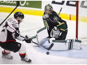 Rouyn-Noranda Huskies' Peter Abbandonato, left, shoots on London Knights goalie Tyler Parsons during first period Memorial Cup hockey action in Red Deer, Alta., on May 24, 2016.