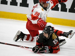 Russian Yekaterina Smolina, left, and Canada's Jaime Bourbonnais during the IIHF Women's Ice Hockey World Championships bronze medal match Canada vs Russia in Espoo, Finland, on Sunday, April 14, 2019.