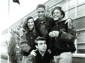 Steffan Watkins, 16, (kneeling), with from left Tammie Woodley, 17, John Jones, 15,  and Nadine Francis, 16 outside West Hill High School on April 22, 1992. Another photo of the four students accompanied a feature on high school graduations a month later.
