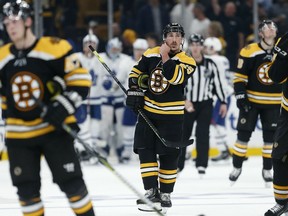 Boston Bruins' Brad Marchand (63) and teammates skate off the ice after losing 2-1 to the Toronto Maple Leafs in Game 5 of an NHL hockey first-round playoff series in Boston, Friday, April 19, 2019.