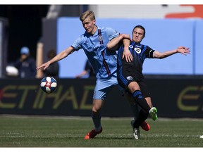 New York City FC midfielder Keaton Parks (55) and Montreal Impact midfielder Samuel Piette (6) battle for the ball during the second half of an MLS soccer match on Saturday, April 6, 2019, in New York.