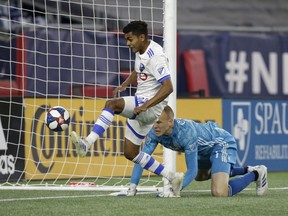 Impact's Shamit Shome taps in a rebound past New England Revolution goalkeeper Cody Cropper on April 24, 2019, at Gillette Stadium in Foxborough, Mass.