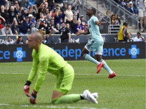 Philadelphia Union's Cory Burke, right, celebrates after scoring a goal past Montreal Impact goalkeeper Evan Bush during the first half on April 20, 2019, in Chester, Pa.