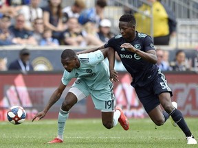 Philadelphia Union's Cory Burke, left, battles Montreal Impact's Zakaria Diallo for the ball during the second half on April 20, 2019, in Chester, Pa. The Union won 3-0.