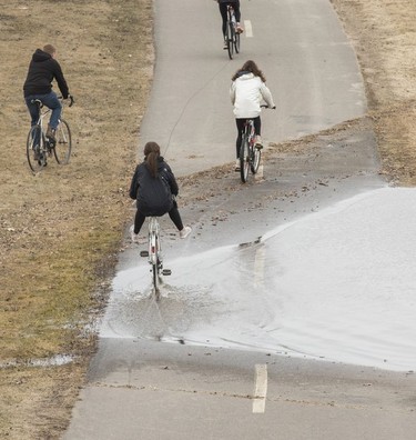 The paths along the green next to the St. John River were beginning to be overtaken as the river rises in Fredericton on Thursday, April 18, 2019. The St. John River is predicted to surpass flood stage of 6.5 meters on Saturday to 6.7 meters. In 2018 the river rose to approximately 8.3 meters and it is predicted that the river will rise to 8.1 meters by Monday.