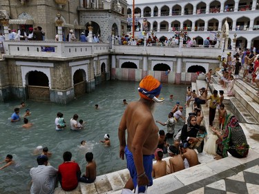 A Sikh pilgrim leaves after taking a holy bath during the Vasakhi festival, at the shrine of Gurdwara Punja Sahib, the second most sacred place for Sikhs, in Hasan Abdal, some 50 kilometers (31 Miles) from Islamabad, Pakistan, Sunday, April 14, 2019. Thousands of Sikh pilgrims arrived from neighboring India and other countries to attend the harvest festival that is regionally known by many names and marks the Solar New Year.