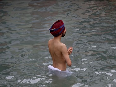 A Sikh pilgrim prays while taking a holy bath during the Vasakhi festival, at the shrine of Gurdwara Punja Sahib, the second most sacred place for Sikhs, in Hasan Abdal, some 50 kilometers (31 Miles) from Islamabad, Pakistan, Sunday, April 14, 2019. Thousands of Sikh pilgrims arrived from neighboring India and other countries to attend the harvest festival that is regionally known by many names and marks the Solar New Year.