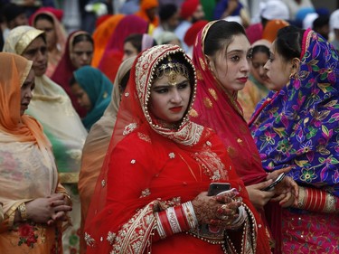 Sikh pilgrims arrive to attend the Vasakhi festival, at the shrine of Gurdwara Punja Sahib, the second most sacred place for Sikhs, in Hasan Abdal, some 50 kilometers (31 Miles) from Islamabad, Pakistan, Sunday, April 14, 2019. Thousands of Sikh pilgrims arrived from neighboring India and other countries to attend the harvest festival that is regionally known by many names and marks the Solar New Year.