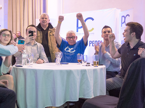 Progressive Conservative supporters cheer as they watch the returns in the Prince Edward Island provincial election in Charlottetown on April 23, 2019.