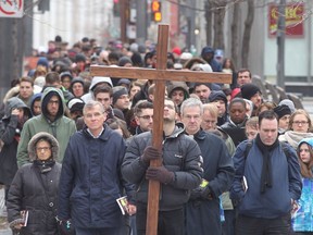 MONTREAL, QUE: APRIL 18, 2014: Several hundred Montrealers marched through the intersection of Viger and McGill Streets as part of the Way of the Cross procession on Good Friday, April 18, 2014. (Pierre Obendrauf / THE GAZETTE) ORG XMIT: 43546