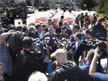 Quebec Premier Francois Legault speaks to reporters after visiting a flooded area on Rue Saint-Louis in Gatineau on Monday, April 22, 2019.