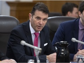Quebec Transport Minister Francois Bonnardel speaks at the beginning of a legislature committee studying a legislation modifying the taxi industry, Wednesday, April 10, 2019 at the legislature in Quebec City.