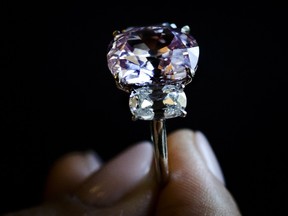 A picture taken on April 30, 2015, shows a 8.72 carats Fancy Vivid Pink diamond during a preview at auction house Sothebys in Geneva.