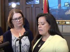 MPs Jane Philpott, left, and Jody Wilson-Raybould are seen in this screen shot from Canadian Press video.