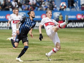 Chicago Fire's Bastian Schweinsteiger, right, defends the ball as Impact's Maximiliano Urruti moves in during second-half action at Saputo Stadium on Sunday.