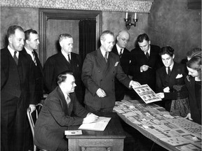 In this April 1942 photo, the Westmount Stamp Club holds an auction to raise money for the Queen’s Canadian Fund, established to help air raid victims in London.