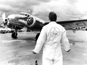 Mechanic Dave Brooks gives all-clear sign to pilot Ray Lank in Air Canada's restored Lockheed 10A, on April 10, 1986. The plane and the coveralls sport the logo of Trans-Canada Air Lines, Air Canada's forerunner; the airline was marking its 50th anniversary. The photo was published in the Montreal Gazette the following day.