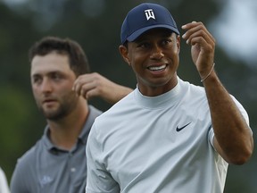 Tiger Woods smiles as he walks off the 18th green during the second round of the Masters Friday, April 12, 2019, in Augusta, Ga.