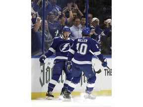 Tampa Bay Lightning center Anthony Cirelli (71) celebrates his goal against the Columbus Blue Jackets with center J.T. Miller (10) during the first period of Game 1 of an NHL Eastern Conference first-round hockey playoff series Wednesday, April 10, 2019, in Tampa, Fla.