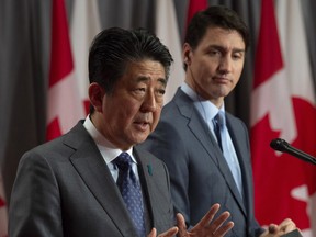 Canadian Prime Minister Justin Trudeau looks on as Japanese Prime Minister Shinzo Abe responds to a question during a visit on Parliament Hill in Ottawa, Sunday April 28, 2019. THE CANADIAN PRESS/Adrian Wyld