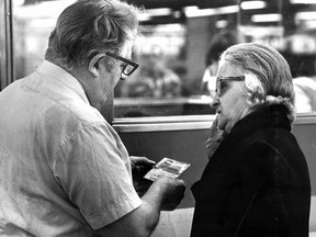 Joseph Thibodeau explains the new monthly transit pass to Mathilda Routhier at Atwater métro station. This photo appeared in the Montreal Gazette on April 2, 1980.