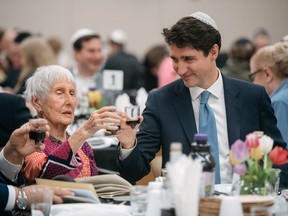 Prime Minister Justin Trudeau chats with Evelyn Rabkin during a Passover Seder at the Bernard Betel Centre in North York, Ontario, Friday, April 19, 2019.