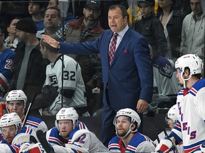 In this Jan. 21, 2018 file photo, New York Rangers coach Alain Vigneault is seen behind the bench during game against the Los Angeles Kings in Los Angeles.