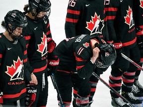 Canadian playesr react after losing the IIHF Women's Ice Hockey World Championships semifinal match between Canada and Finland in Espoo, Finland, Saturday, April 13, 2019.