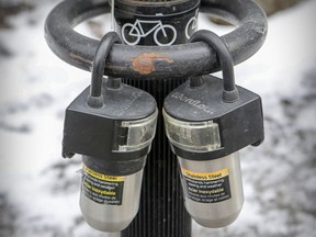 Lockboxes for AirBnB rental units are attached to a parking meter in downtown Montreal in January.