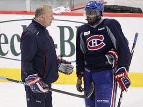 Montreal Canadiens head coach Michel Therrien talks with defenceman P.K. Subban at the Bell Sports Complex in Brossard on March 13, 2015.