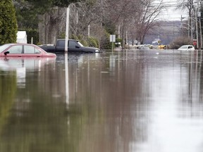 MONTREAL, QUE.: APRIL 29, 2019 -- A flooded street in Ste-Marthe-sur-le-Lac west of Montreal Monday April 29, 2019. (John Mahoney / MONTREAL GAZETTE) ORG XMIT: 62436 - 3889