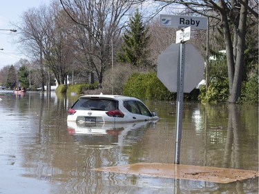 A submerged car is seen in Sainte-Marthe-sur-le-Lac, Quebec April 30, 2019.
