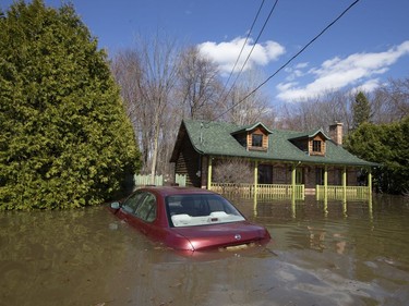 A submerged car is seen in Sainte-Marthe-sur-le-Lac, Quebec April 30, 2019.