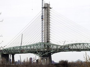 The new Champlain Bridge rises high above the old one, whose deconstruction is scheduled to begin in the winter of 2020.