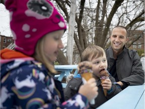 Montreal Impact goalkeeper Evan Bush watches as his children, Isabella and Canaan, enjoy an ice cream at Wild Willy's in Montreal on Thursday, May 2, 2019.